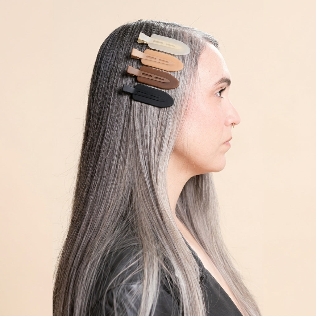 Model wearing four neutral jelly hair clips along the side of her hair