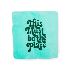 This Must be the Place blanket in turquoise with green font
